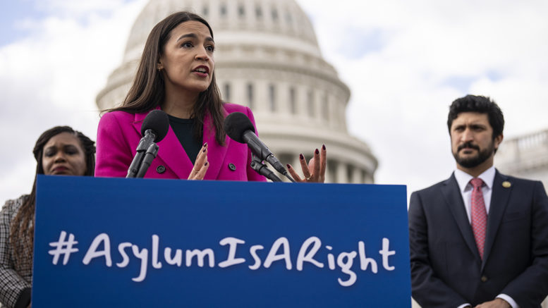 Boggled by Biden’s Border Crisis? Relax, AOC Is in Charge